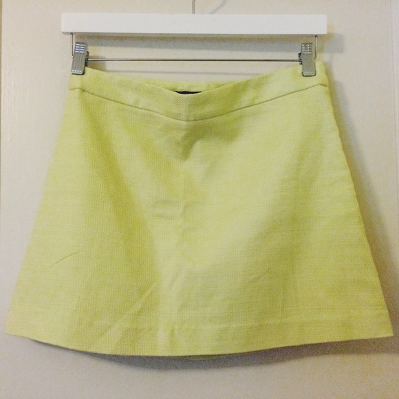 High-waisted, A-line pastel yellow/green skirt