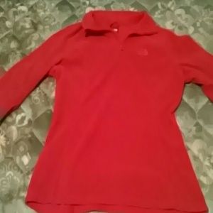 Red pull over. Never worn