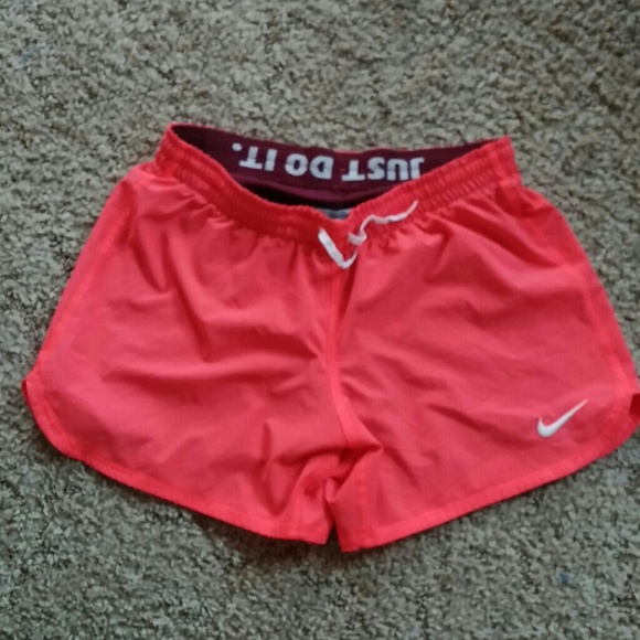 Nike coral and maroon running shorts