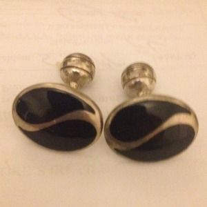 Sterling silver cuff links with black enamel.