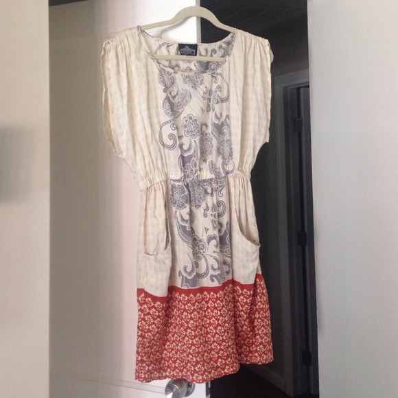 Dress with front pocket detail by Angie.