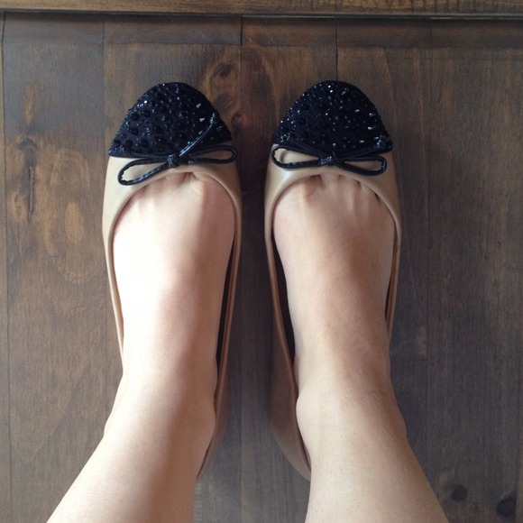 Nude and black flats