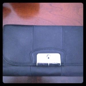 Coach tri-fold wallet with pink interior