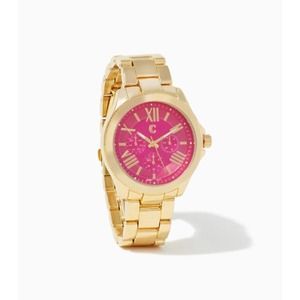 Pink face surrounded by a gold frame