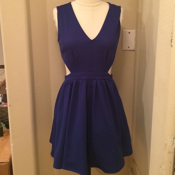 Navy sleeveless dress with side cutouts.