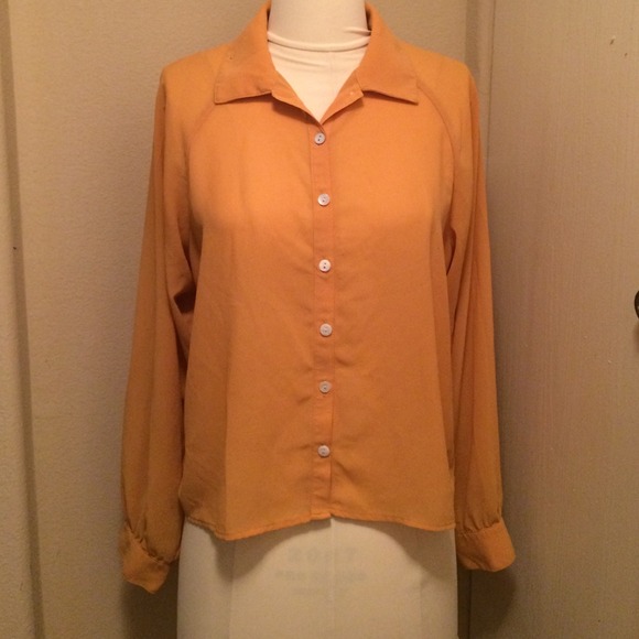 Mustard collard shirt with shirring on back.