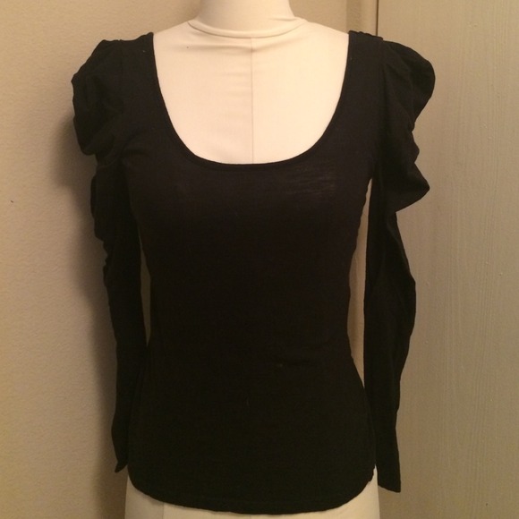 Ruffle sleeve top with scoop neck.