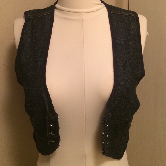 Cropped denim vest.