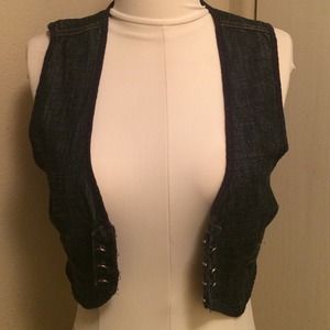 Cropped denim vest.