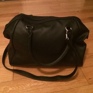 Pleather bowling bag with cross body strap.