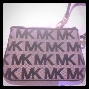 Brand new with tag Michael Kors brown wristlet