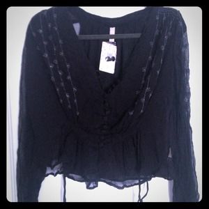 Brand new black free people blouse. Size: XS