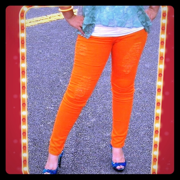 Orange distressed colored skinny jeans