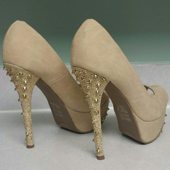Gold spike heels.