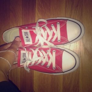 Converse red low tops.