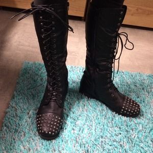 Tall black combat boots