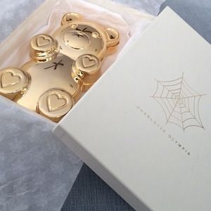 Charlotte Olympia gold gummy bear clutch