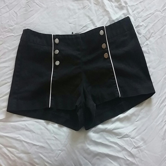 Black low waisted sailor shorts.
