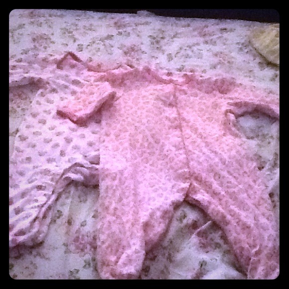 Pink and white baby onesies
