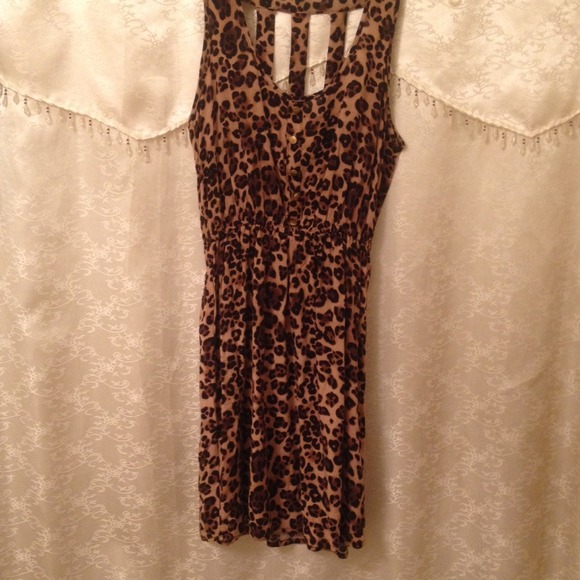 Cute dress, cheetah, jail bar straps on back