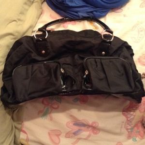 Anchor blue black purse small tear