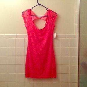 Pink lace open back dress.