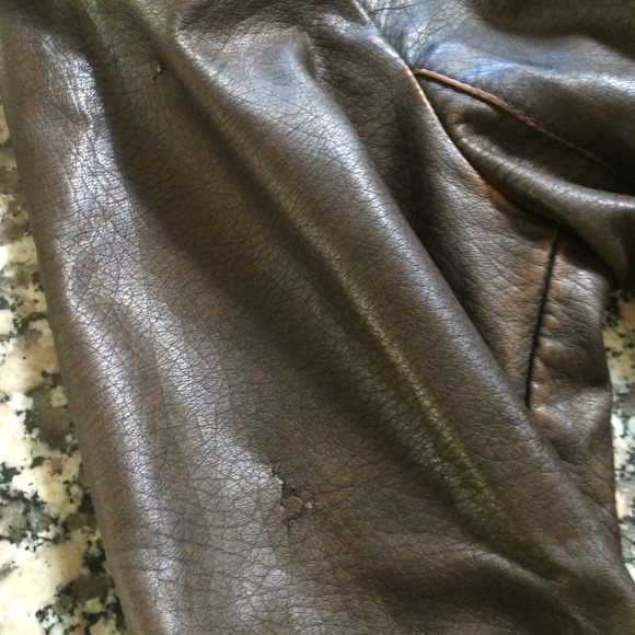 Damage to faux leather jacket