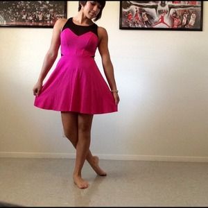 Pink dress with black top around the neck
