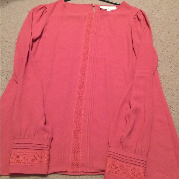 Mauve blouse with keyhole back .