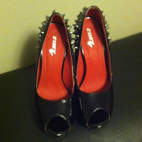 Red sole black spike heel