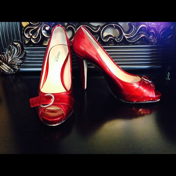 Candy-apple red peep toe pumps