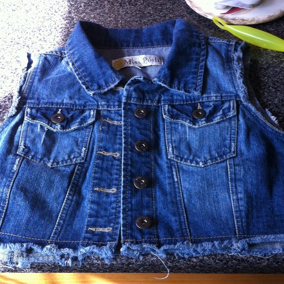 Distressed denim vest