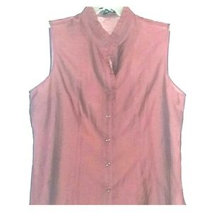 Sheer button up, ruffles around neck down chest.