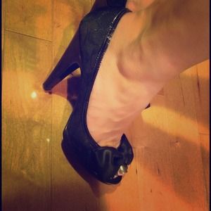 Authentic Coach classy peep toe pumps.