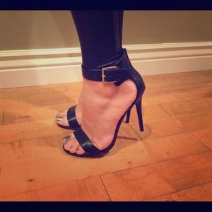 Open toe Steve Madden pumps with ankle buckle.