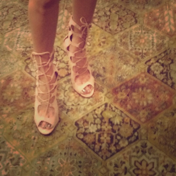 Peach/beige lace-up pumps.