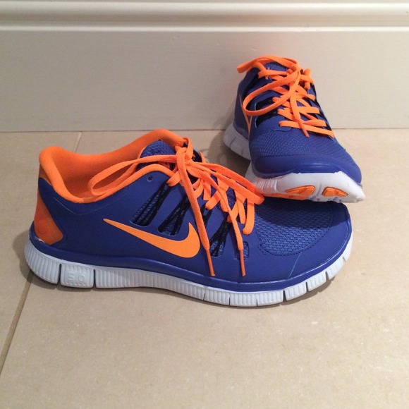 Purple and neon orange women's nike 5.0 free runs