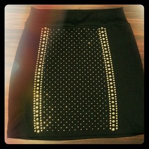 Fitted black skirt with gold stud jewels