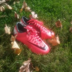 Nike pink and black cleats