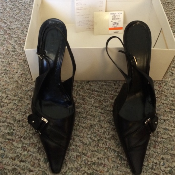 Black 2 inch heels worn but in good condition.