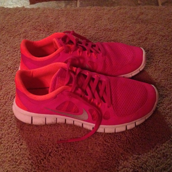 Pink and orange Nike running shoes