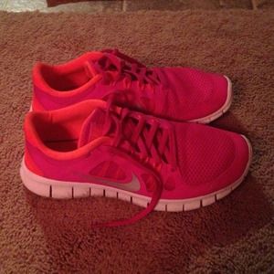 Pink and orange Nike running shoes