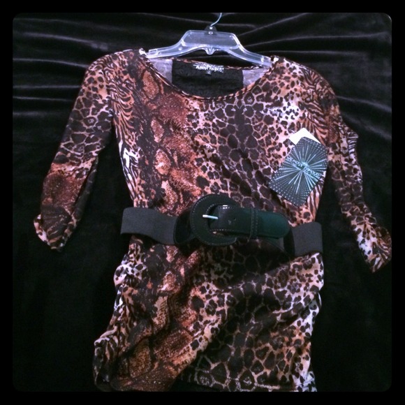 A cheetah print shirt. With a black leather belt.