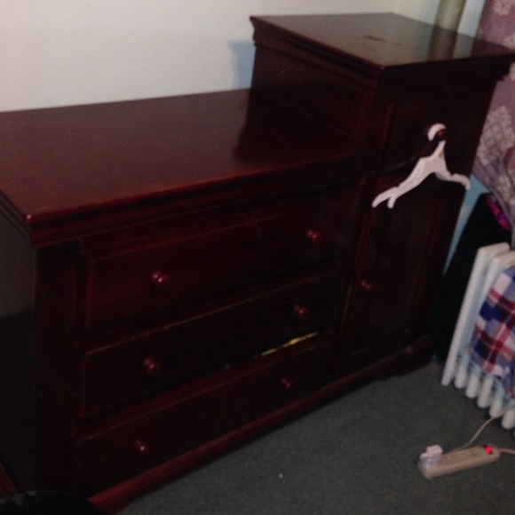 A baby changer table /dresser/