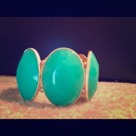 Green stones and gold bracelet