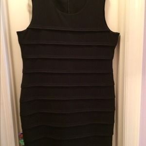 Beautiful black cocktail dress-form fitting