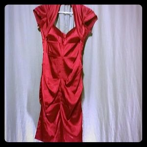 Red silky form-fitting dress with cap sleeves