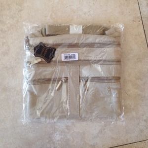 NEW!!IN BAG WITH TAGS cream colored leather bag