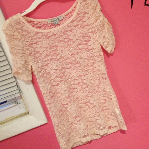 Elegant pink lace top with pearls