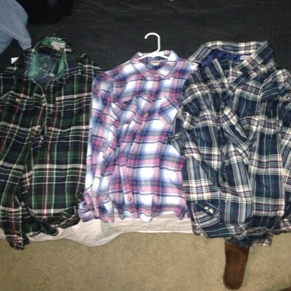 A lot of 3 flannels. 2 are large and one is medium